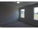 Neutral bedroom with two windows and neutral carpet at 200 Ironwood Lot 39 Blvd, Youngsville, NC 27596