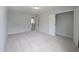 Bright bedroom with neutral carpet, a closet, and an open doorway to the home's second level at 200 Ironwood Lot 39 Blvd, Youngsville, NC 27596
