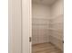 Walk-in pantry with white shelving, offering ample storage space at 200 Ironwood Lot 39 Blvd, Youngsville, NC 27596
