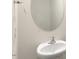Bathroom with a white sink, a mirror, and a towel holder on the wall at 262 Moore Creek Dr, Fuquay Varina, NC 27526