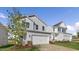 Charming two-story home features a two-car garage and pristine landscaping at 262 Moore Creek Dr, Fuquay Varina, NC 27526