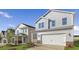 Two-story home with pristine landscaping and a spacious two-car garage at 262 Moore Creek Dr, Fuquay Varina, NC 27526
