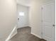 View of the foyer with wood floors and a white door with glass leading outside at 262 Moore Creek Dr, Fuquay Varina, NC 27526