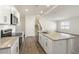 Kitchen with stainless steel appliances, granite countertops, and a view of the stairs at 262 Moore Creek Dr, Fuquay Varina, NC 27526