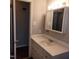 Bathroom with white vanity, medicine cabinet, and toilet at 2800 Coleman Loop Rd, Hillsborough, NC 27278