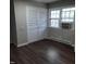 Bedroom with white closet doors and laminate flooring at 2800 Coleman Loop Rd, Hillsborough, NC 27278