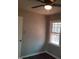 A cozy bedroom featuring neutral walls, dark hardwood floors, a ceiling fan with light, and one window at 2800 Coleman Loop Rd, Hillsborough, NC 27278