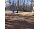 Exterior shot of the driveway with a pile of garbage receptacles in the background at 2800 Coleman Loop Rd, Hillsborough, NC 27278
