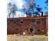 Exterior shot of the back of the house, which is brick at 2800 Coleman Loop Rd, Hillsborough, NC 27278