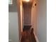 An interior shot of a hallway featuring wood floors and white doors at 2800 Coleman Loop Rd, Hillsborough, NC 27278