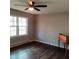 Living room with dark laminate wood flooring and a ceiling fan at 2800 Coleman Loop Rd, Hillsborough, NC 27278