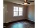 Living room with dark laminate wood flooring and a ceiling fan at 2800 Coleman Loop Rd, Hillsborough, NC 27278