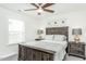 Bedroom with a full-size bed and ceiling fan at 418 Providence Springs Ln, Fuquay Varina, NC 27526