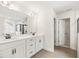 Modern bathroom featuring double vanity with quartz countertop and modern fixtures at 906 Brookfield Dr, Gibsonville, NC 27249
