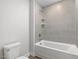 New bathroom showcasing a tiled shower and a modern toilet at 906 Brookfield Dr, Gibsonville, NC 27249