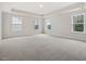Expansive main bedroom featuring tray ceilings, neutral carpet, and ample natural light at 906 Brookfield Dr, Gibsonville, NC 27249