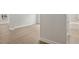 Bright bedroom featuring light wood floors, white walls, and large windows at 906 Brookfield Dr, Gibsonville, NC 27249