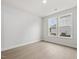 Bright bedroom with neutral walls, wood floors, and natural light from double windows at 906 Brookfield Dr, Gibsonville, NC 27249