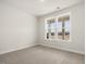 Bright bedroom with neutral carpet and large windows offering ample natural light at 906 Brookfield Dr, Gibsonville, NC 27249