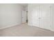 A serene bedroom featuring plush carpeting and a spacious closet with double doors at 906 Brookfield Dr, Gibsonville, NC 27249