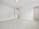 Spacious bedroom with carpeted floors, a closet and a door, providing ample room at 906 Brookfield Dr, Gibsonville, NC 27249