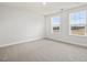 Light-filled bedroom with two windows and neutral carpet, offering a relaxing space at 906 Brookfield Dr, Gibsonville, NC 27249
