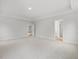 Large carpeted bedroom with tray ceilings, recessed lights, and an en-suite bathroom at 906 Brookfield Dr, Gibsonville, NC 27249