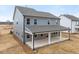 New construction home with a covered patio and gray siding at 906 Brookfield Dr, Gibsonville, NC 27249