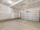 Spacious two car garage with concrete floor and unfinished drywall at 906 Brookfield Dr, Gibsonville, NC 27249