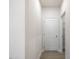 Hallway with access to pantry and bathroom features hardwood floors and neutral wall color at 906 Brookfield Dr, Gibsonville, NC 27249