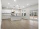 Eat in kitchen with white cabinets, central island, modern fixtures, and stainless appliances at 906 Brookfield Dr, Gibsonville, NC 27249