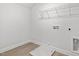 Laundry room with vinyl flooring and wire shelving at 906 Brookfield Dr, Gibsonville, NC 27249