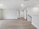 Large open living room with light wood flooring and neutral walls creating a warm and inviting atmosphere at 906 Brookfield Dr, Gibsonville, NC 27249