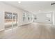 Spacious living room with wood floors, recessed lighting, and sliding door to patio at 906 Brookfield Dr, Gibsonville, NC 27249