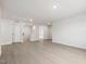 Spacious living room featuring hardwood style floors, recessed lighting, and open concept design at 906 Brookfield Dr, Gibsonville, NC 27249