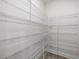 Walk-in pantry with extensive metal shelving provides ample storage space and easy organization at 906 Brookfield Dr, Gibsonville, NC 27249