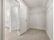 Bright walk-in closet with shelving and a door leading to the ensuite bathroom at 906 Brookfield Dr, Gibsonville, NC 27249