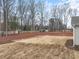 Spacious backyard with freshly laid pine straw and seeded lawn at 910 Brookfield Dr, Gibsonville, NC 27249