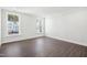 Bright bedroom with natural light streaming through two windows at 11548 Helmond Way # 118, Raleigh, NC 27617