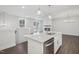 Spacious kitchen with island, stainless steel dishwasher and modern finishes throughout the open living space at 11548 Helmond Way # 118, Raleigh, NC 27617
