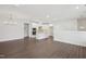 Open-concept layout featuring living room and modern kitchen with a large kitchen island at 11548 Helmond Way # 118, Raleigh, NC 27617
