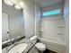 Bright bathroom featuring a shower-tub combo, granite countertop, and framed mirror at 166 Vega Loop, Sanford, NC 27330