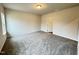 Spacious bedroom with neutral carpet, blank walls, and a doorway at 166 Vega Loop, Sanford, NC 27330