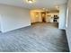 Expansive living space featuring hard surface flooring and an open layout to kitchen and dining at 166 Vega Loop, Sanford, NC 27330