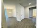 Bright open-concept living area featuring wood-look flooring and a view into dining area at 166 Vega Loop, Sanford, NC 27330