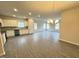 Well-lit open-concept living space blending kitchen, dining, and living areas with hard surface floors at 166 Vega Loop, Sanford, NC 27330