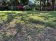 Grassy backyard with swing and blooming azaleas; perfect for relaxing at 2705 Royster St, Raleigh, NC 27608
