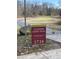 Sign for Crabtree Creek Trail along the Capital Area Greenway with path in background at 2705 Royster St, Raleigh, NC 27608
