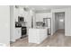 Modern kitchen with white cabinets and island at 283 White Birch Ln, Angier, NC 27501