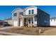 Two-story house featuring gray siding, brick accents, and a two-car garage at 51 White Birch Ln, Angier, NC 27501